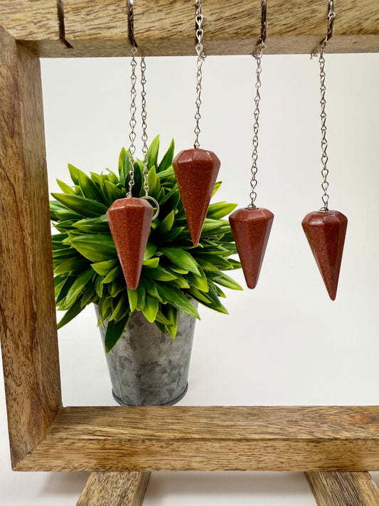 Red Goldstone Pendulums